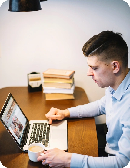 Professional working on a laptop at a desk